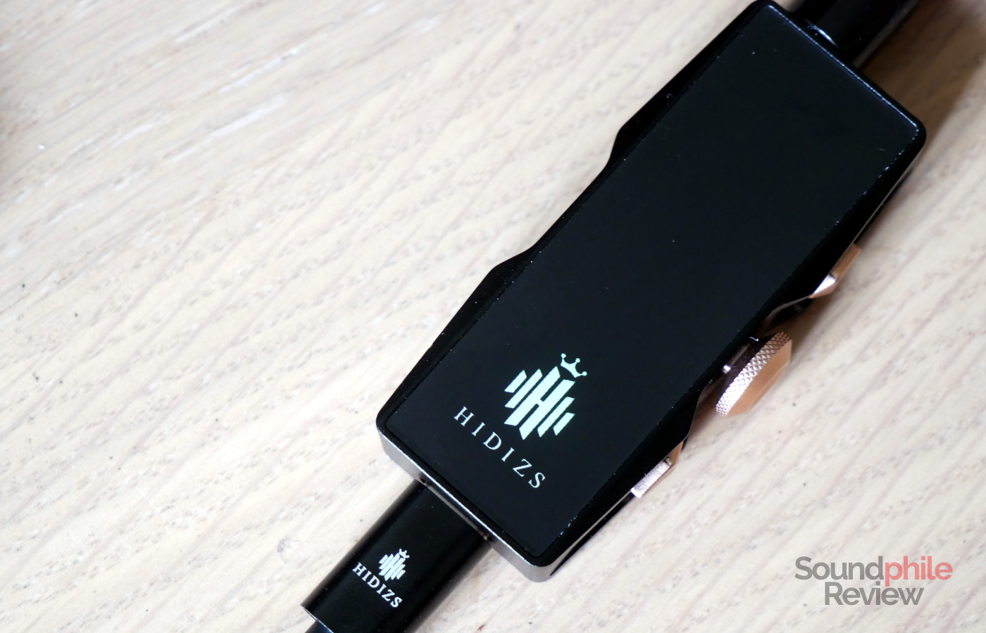 The Hidizs S8 Pro Robin has a glowing logo on its front
