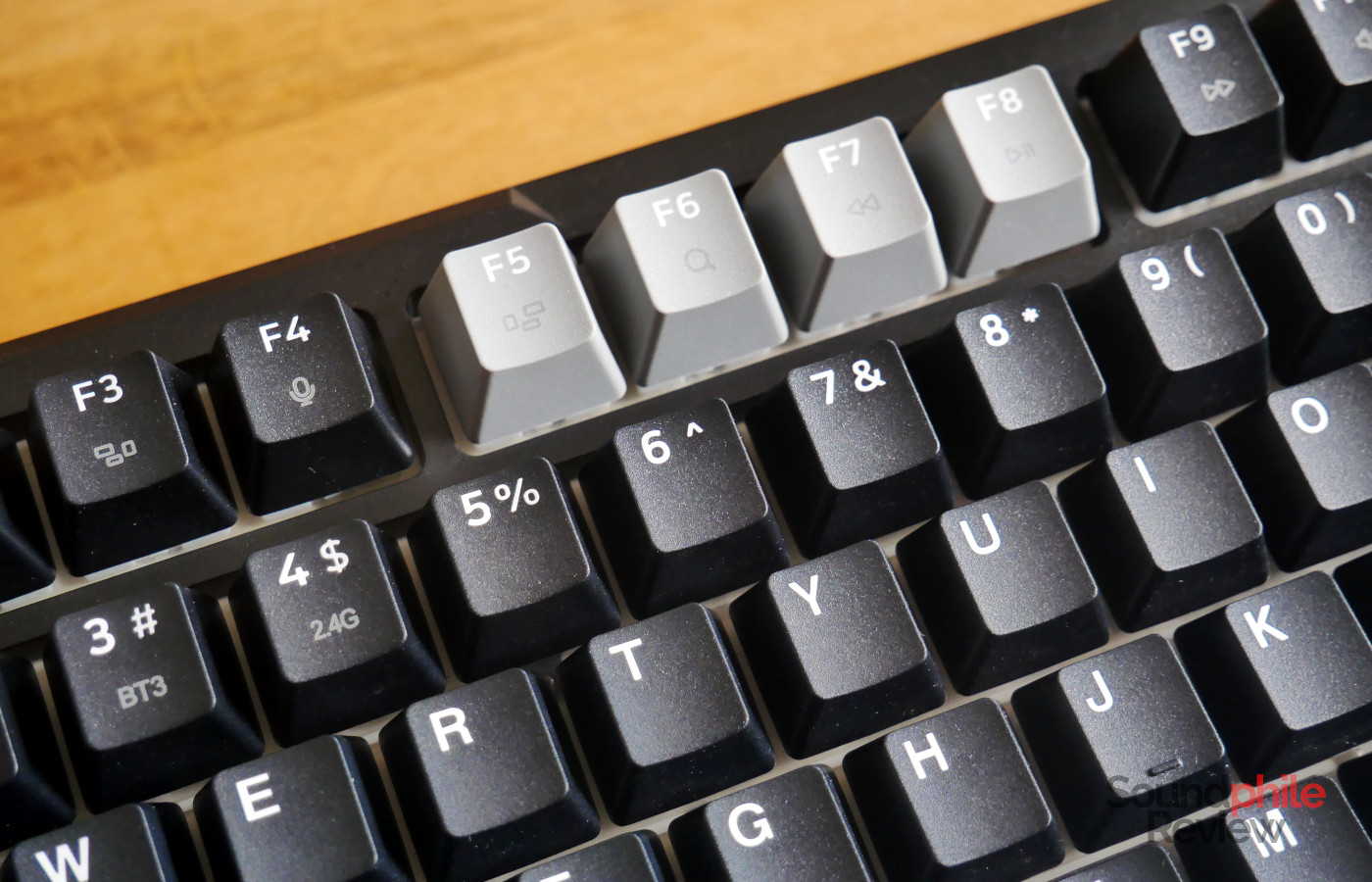 The Redragon K742 has legends in grey on keys, which are barely legible.