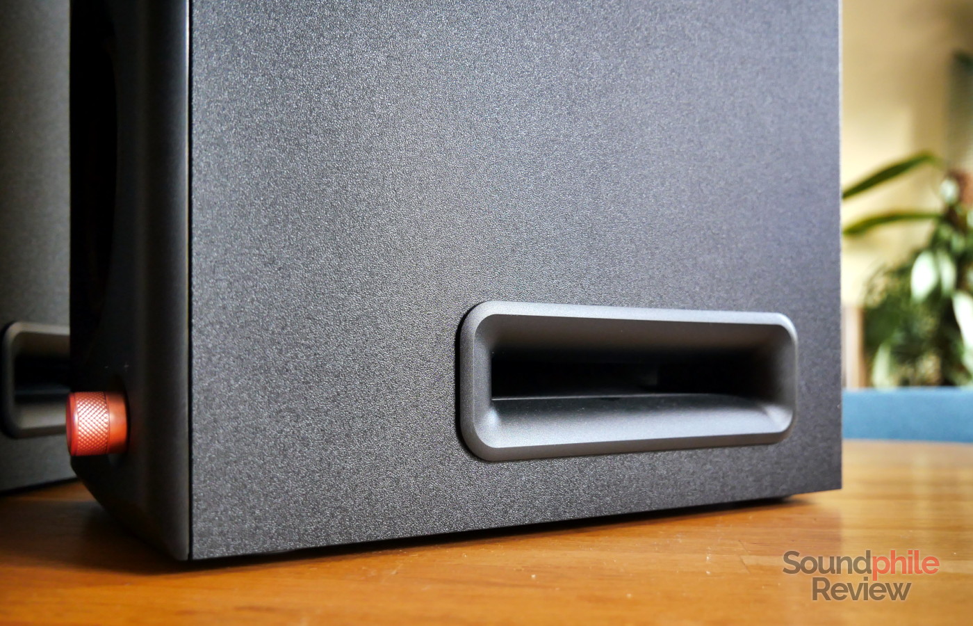 The Edifier MR5 have slits that allow air to escape from the hidden 5-inch woofer