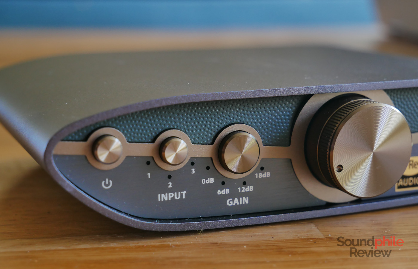 There are three buttons to the left of the volume knob on the iFi ZEN CAN 3: power, input and gain