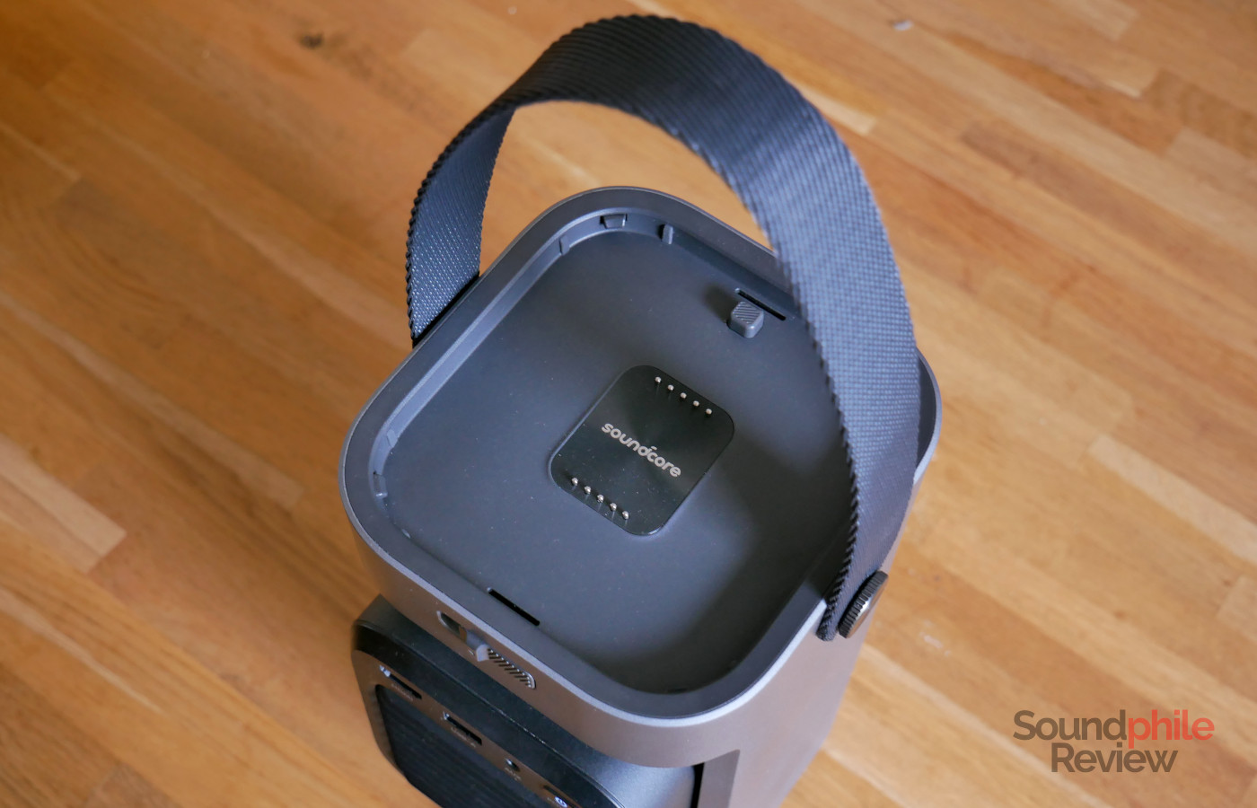 The Soundcore Nebula P1 has a fabric handle on top.